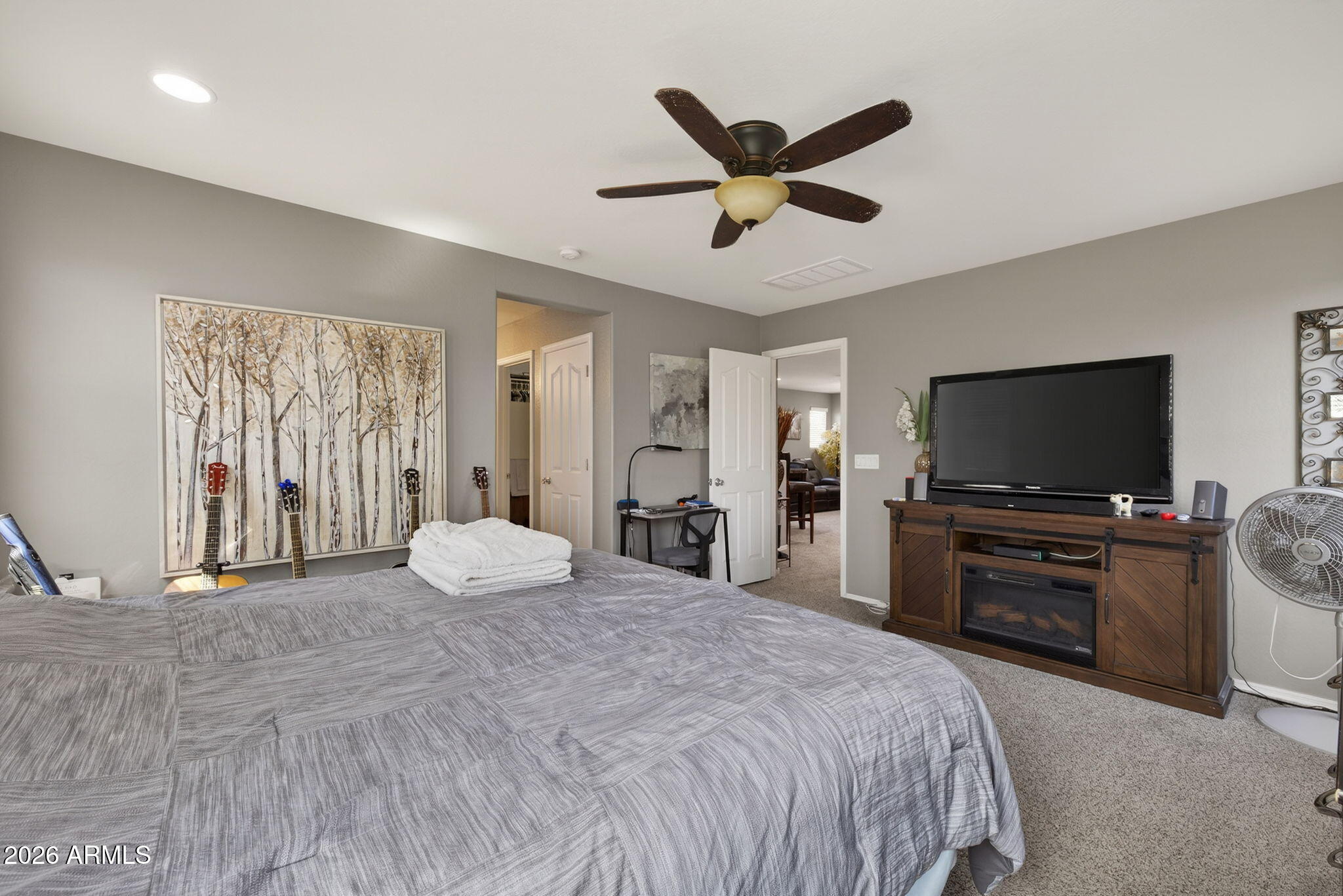 921 South Swallow Lane Gilbert, AZ 85296 - Photo 21 of 36 a bedroom with a bed and a flat screen tv