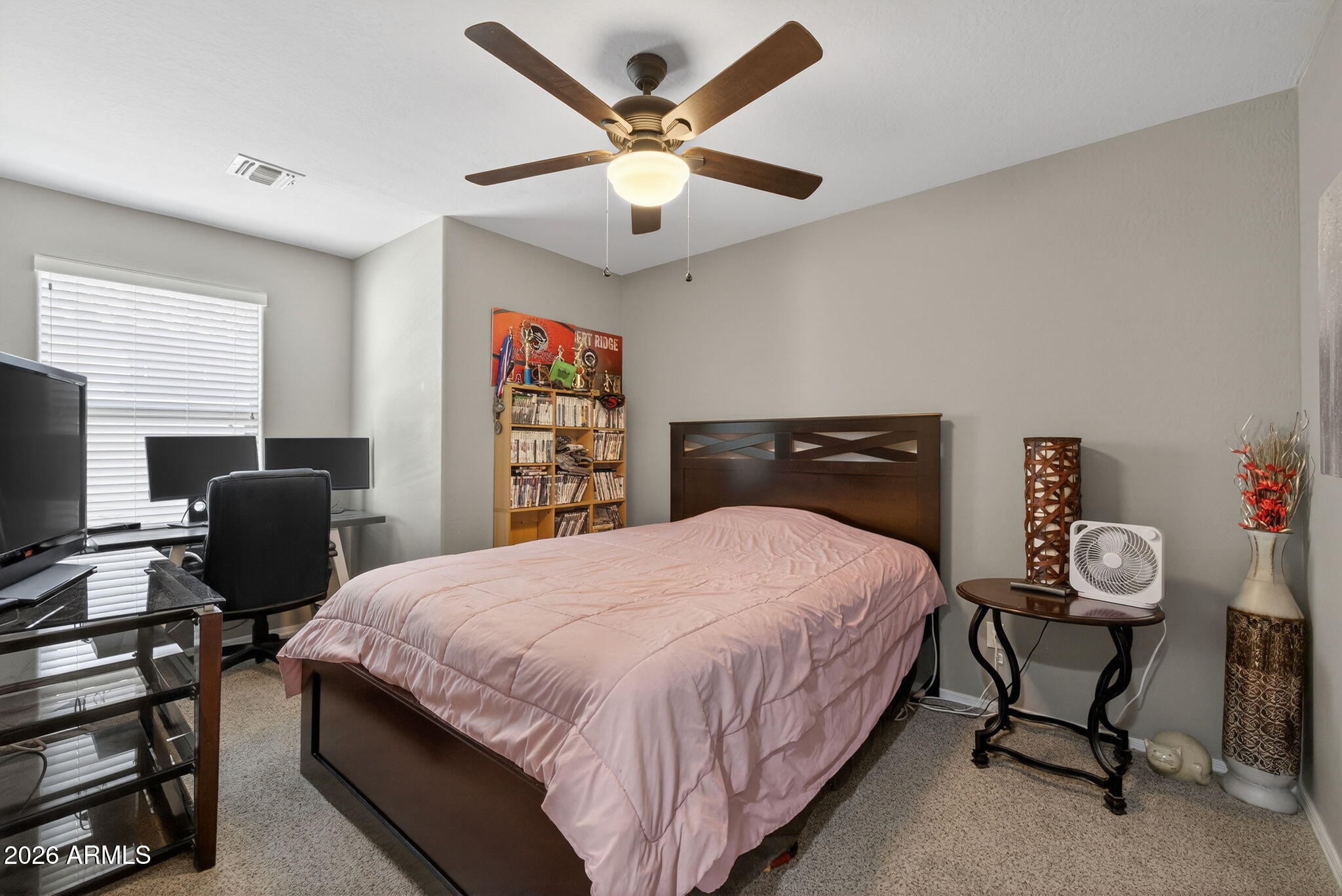 921 South Swallow Lane Gilbert, AZ 85296 - Photo 24 of 36 a bedroom with a bed and a desk