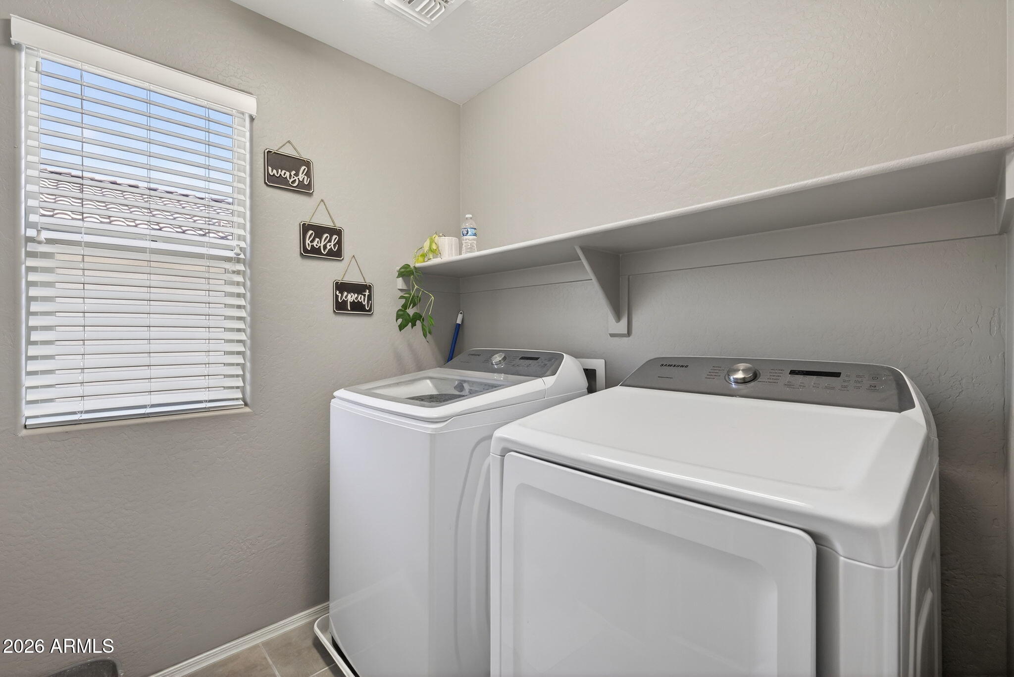 921 South Swallow Lane Gilbert, AZ 85296 - Photo 28 of 36 a utility room with dryer and washer