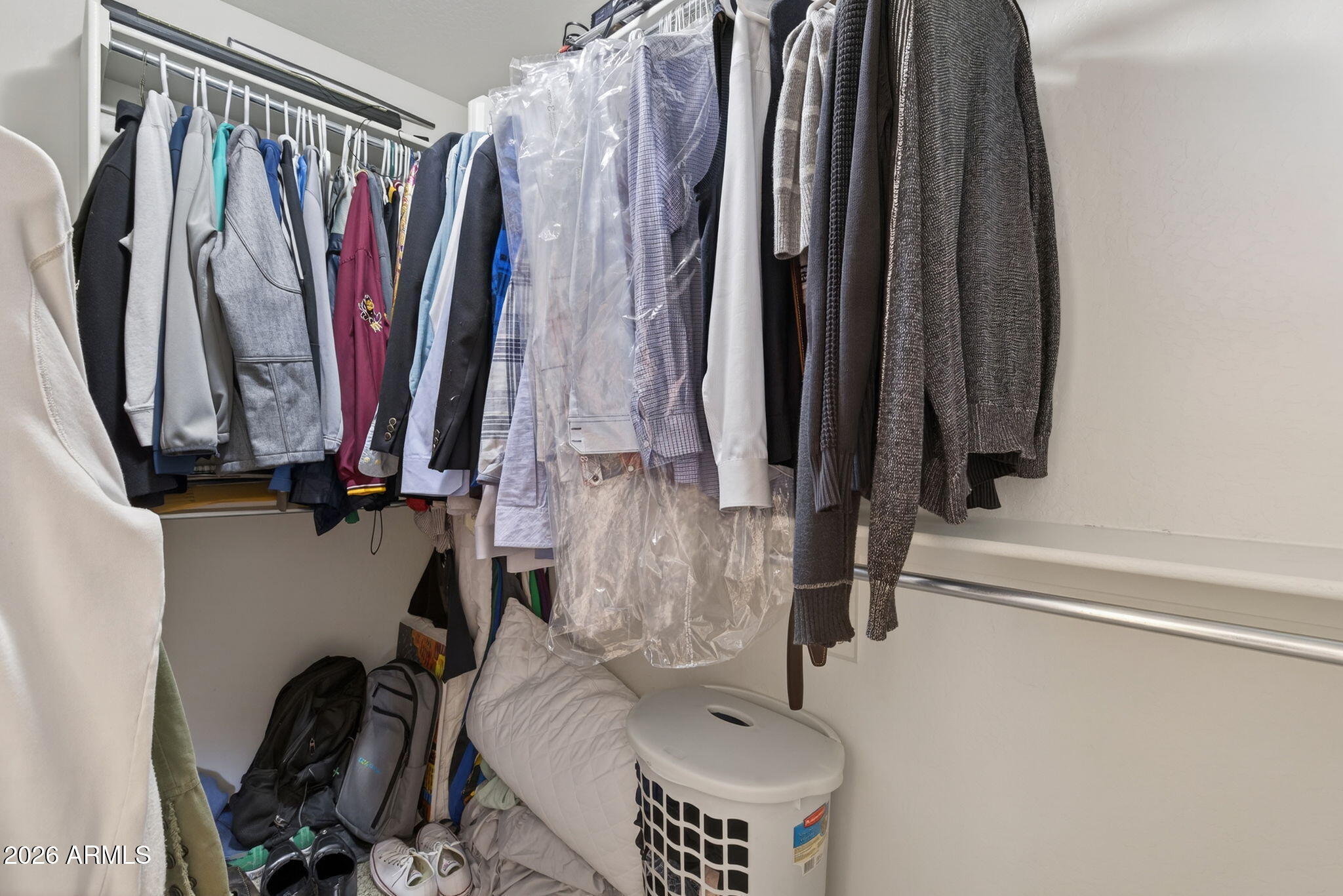 921 South Swallow Lane Gilbert, AZ 85296 - Photo 29 of 36 a view of walk in closet with clothes