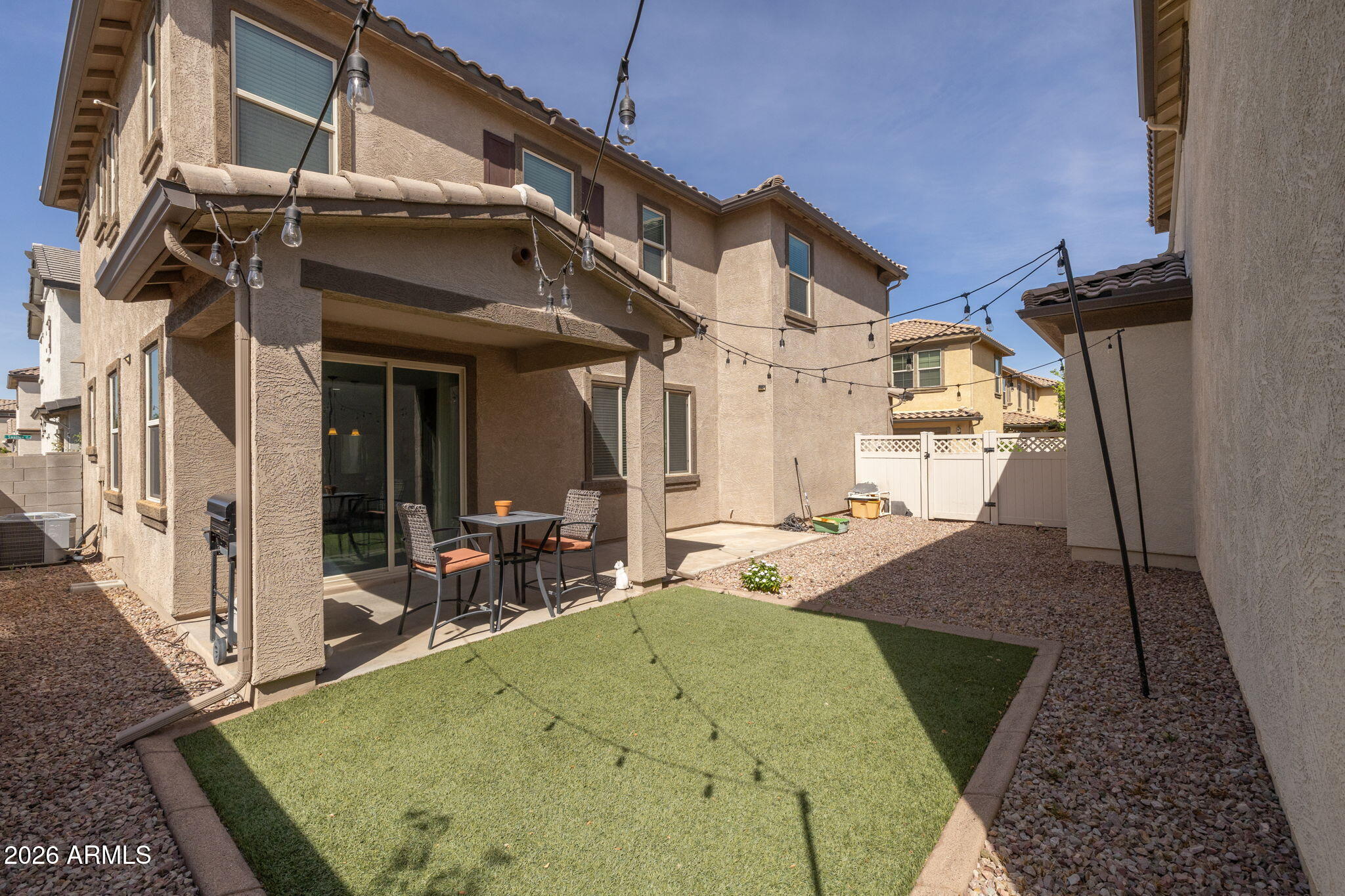 921 South Swallow Lane Gilbert, AZ 85296 - Photo 31 of 36 a view of a house with pool and chairs