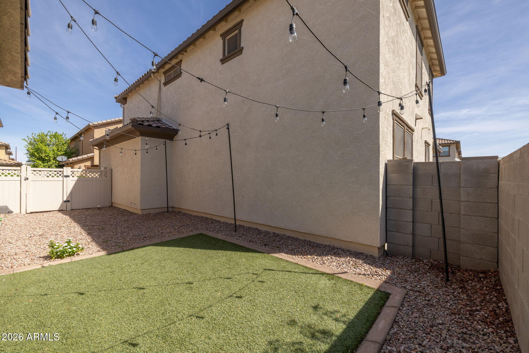 921 South Swallow Lane Gilbert, AZ 85296 - Photo 32 of 36 a house view with a backyard