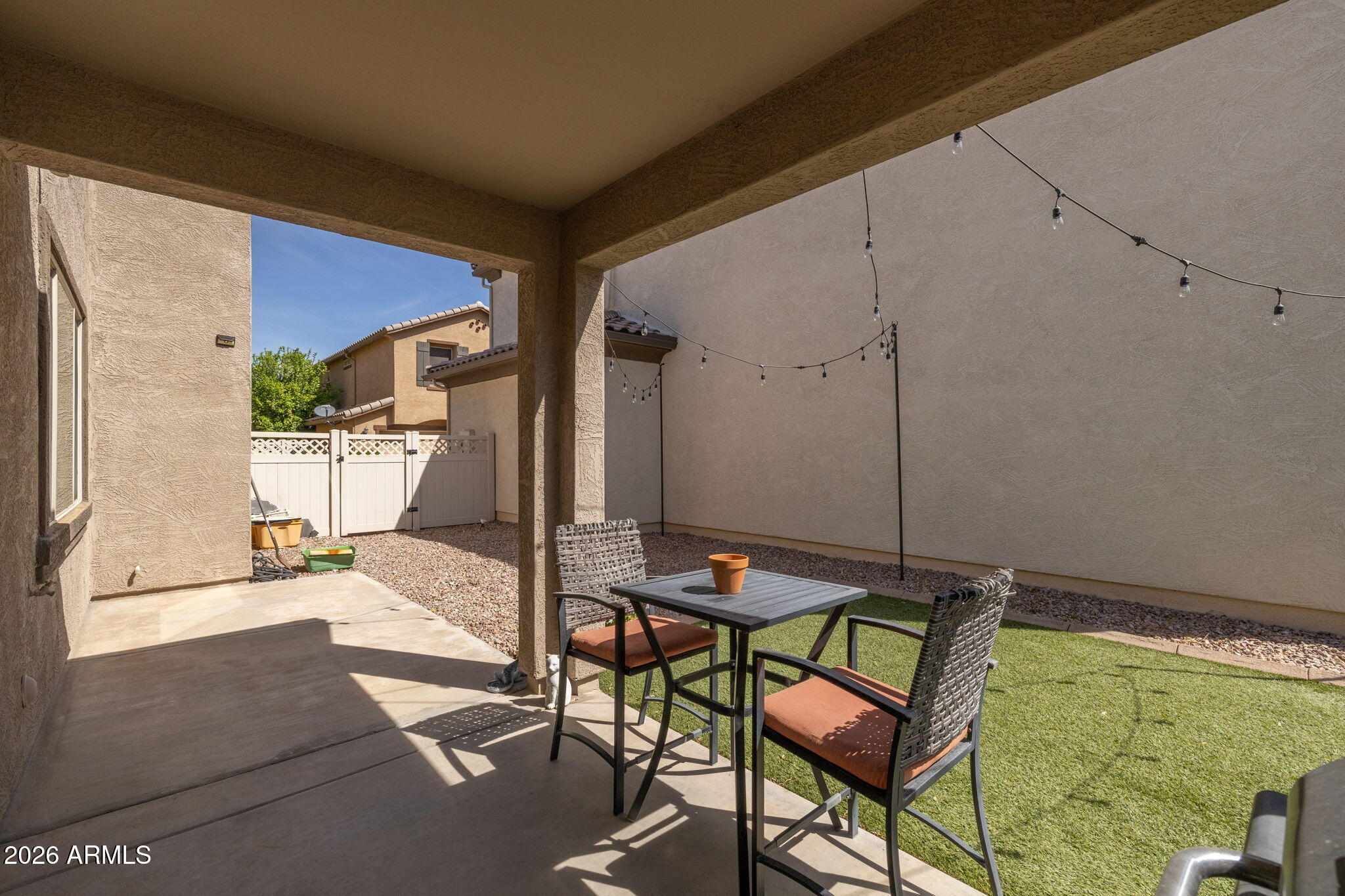 921 South Swallow Lane Gilbert, AZ 85296 - Photo 33 of 36 a patio with a table and chairs