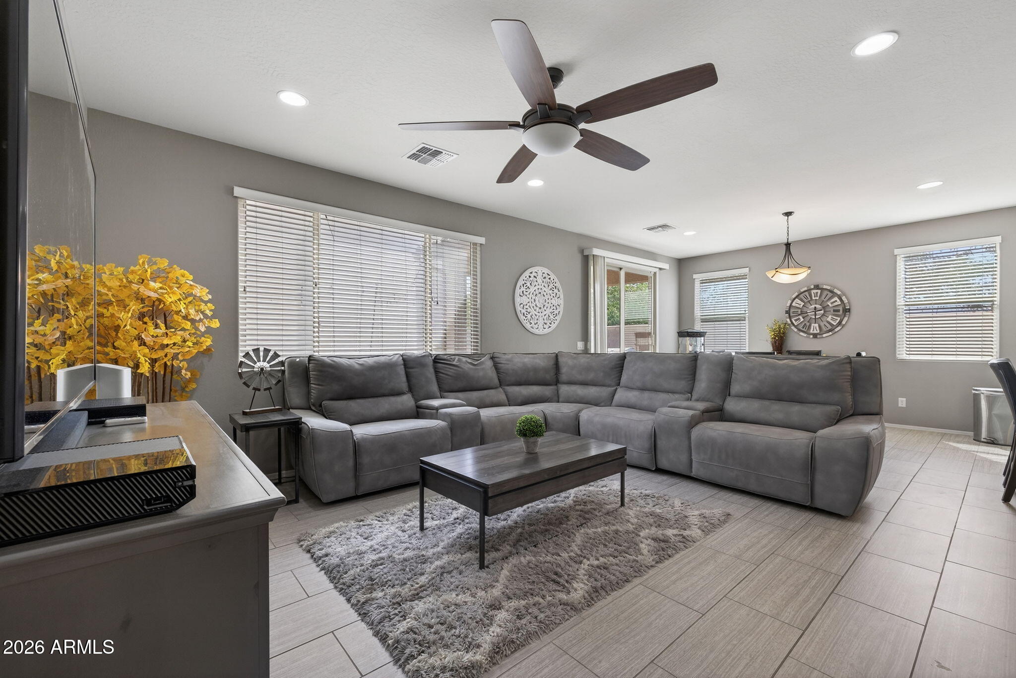 921 South Swallow Lane Gilbert, AZ 85296 - Photo 4 of 36 a living room with furniture and a large window