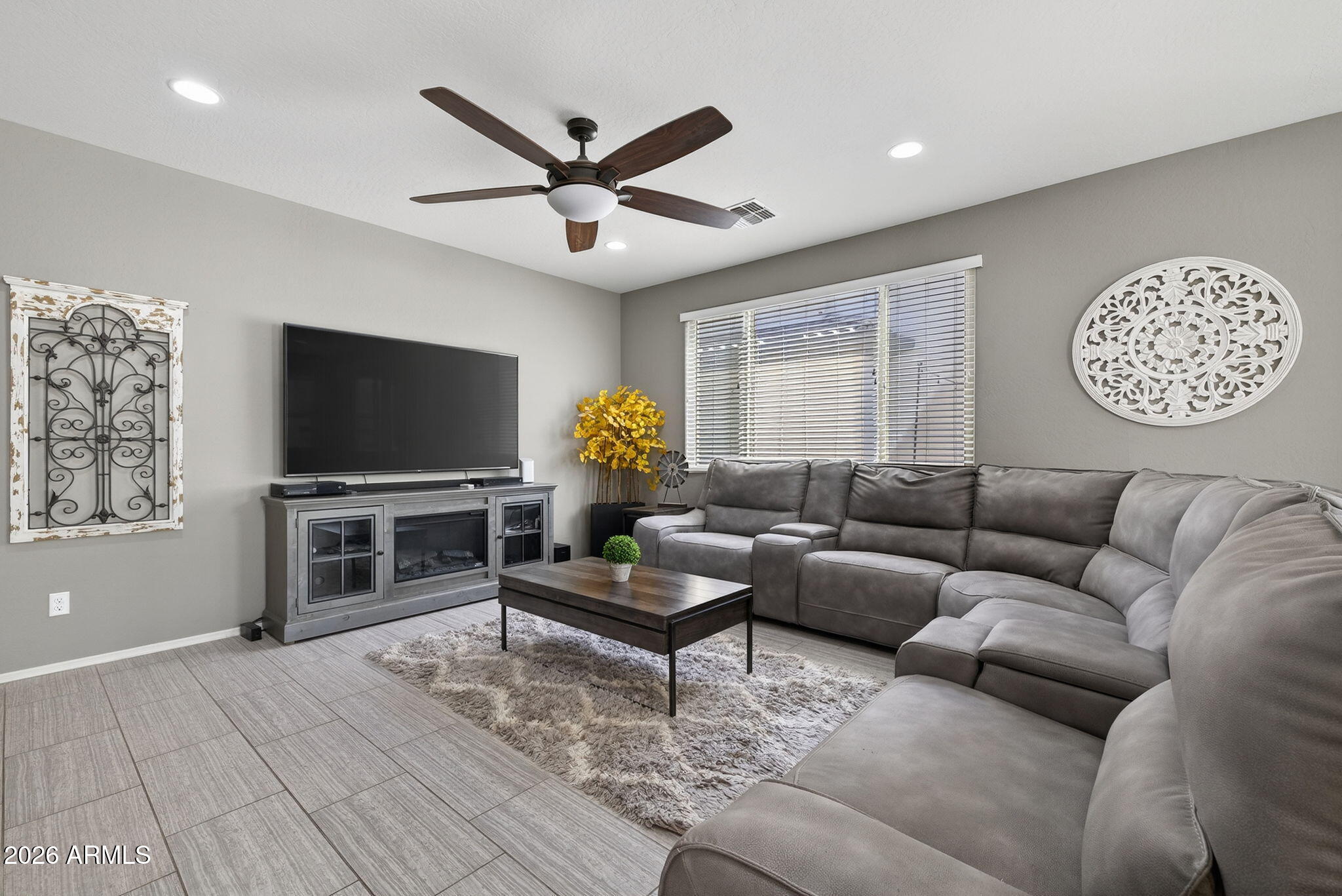 921 South Swallow Lane Gilbert, AZ 85296 - Photo 5 of 36 a living room with furniture and a flat screen tv