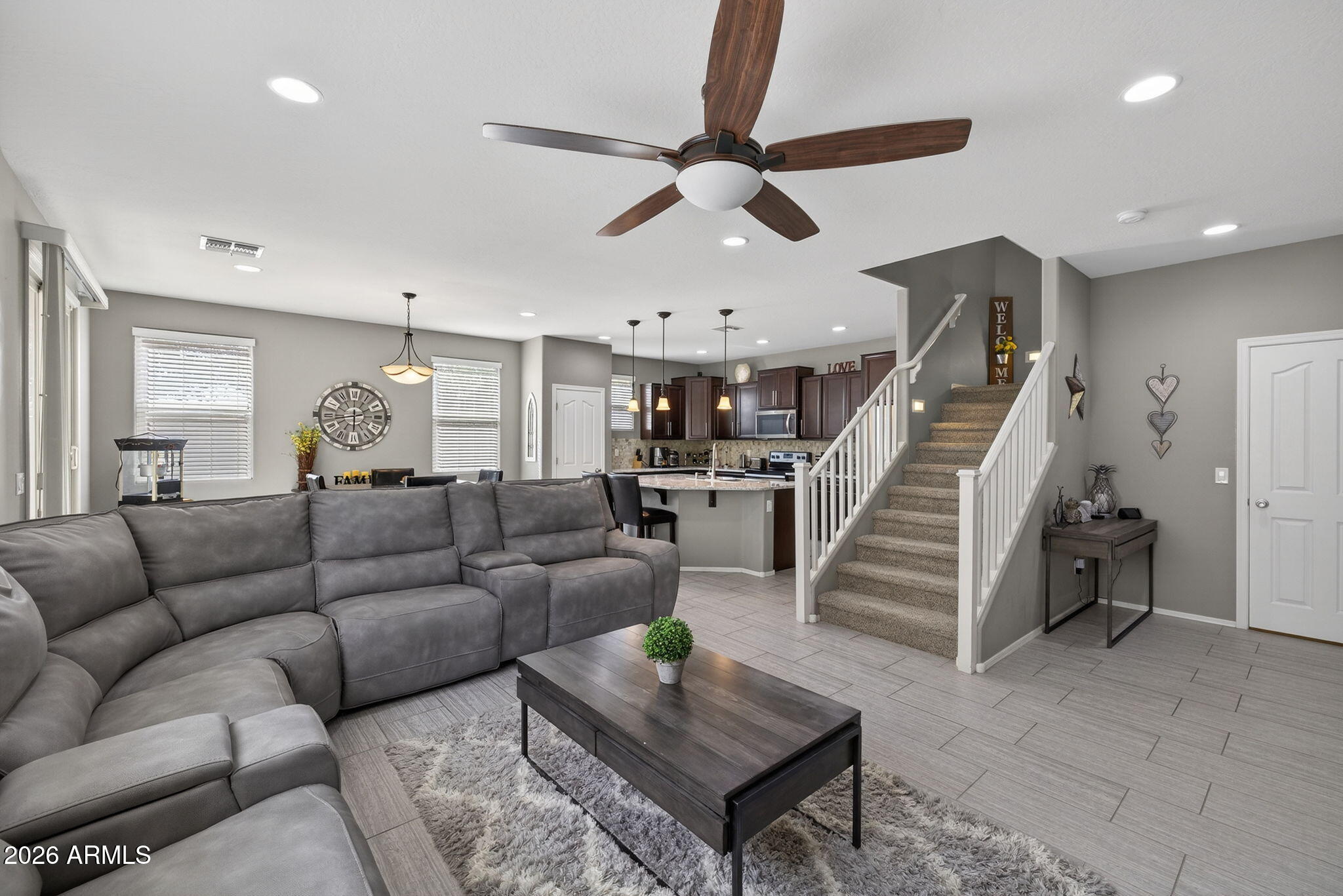 921 South Swallow Lane Gilbert, AZ 85296 - Photo 7 of 36 a living room with furniture and wooden floor