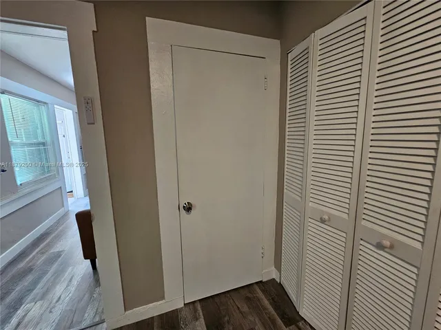 a view of a bedroom from a hallway