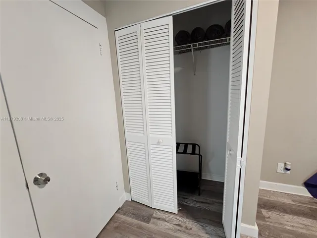 a bathroom with a sink a glass door shower and a mirror