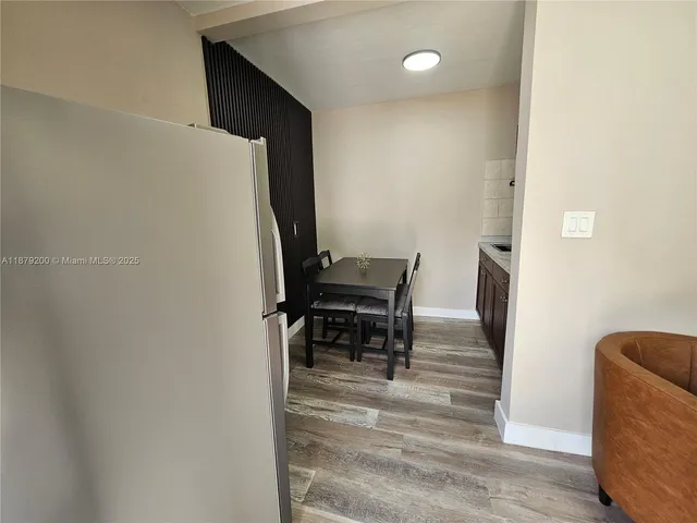 a view of kitchen with furniture and a piano
