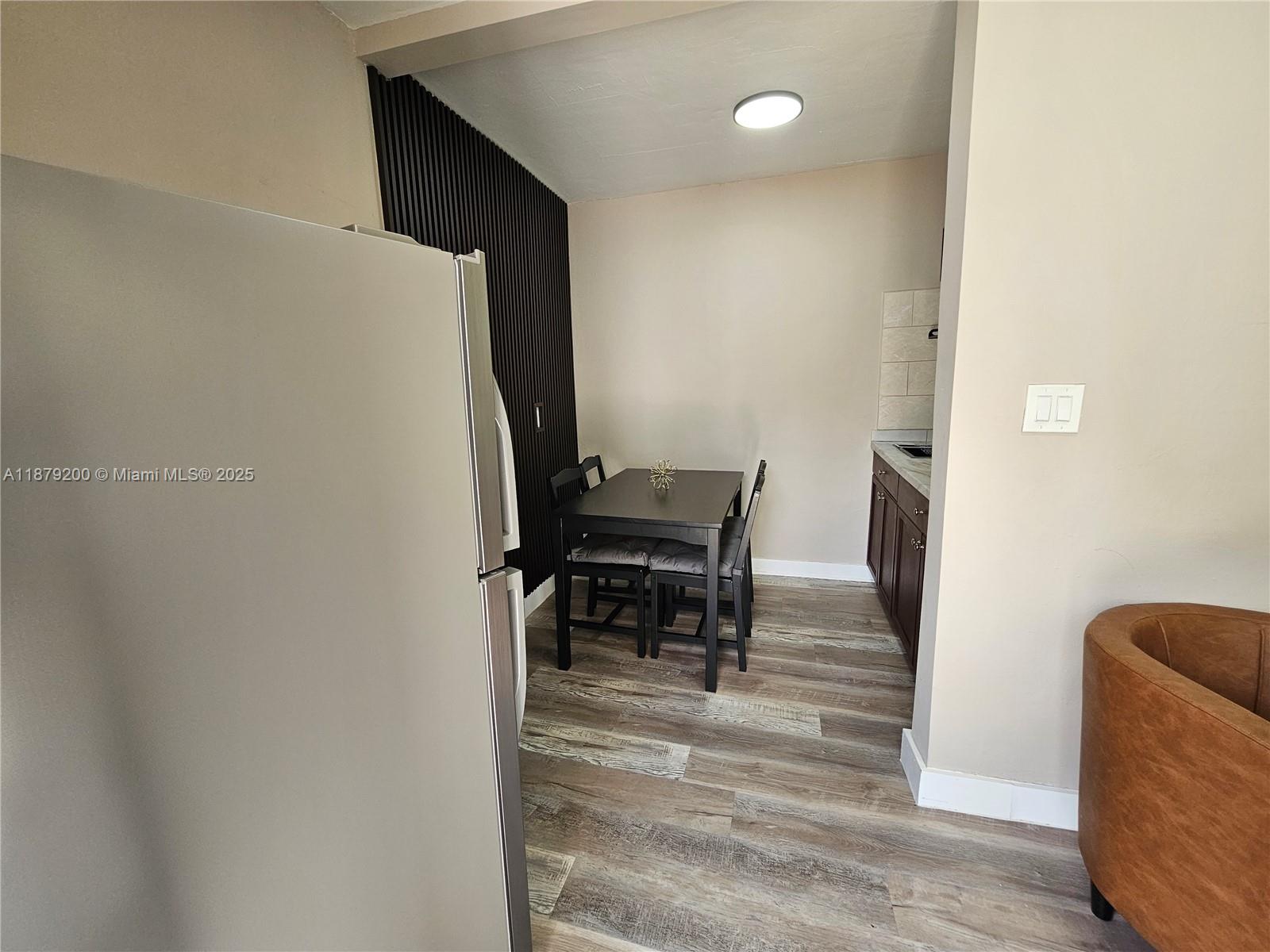 1265 Southwest 4th Street, Unit 4 Miami, FL 33130 - Photo 6 of 24 a view of kitchen with furniture and a piano