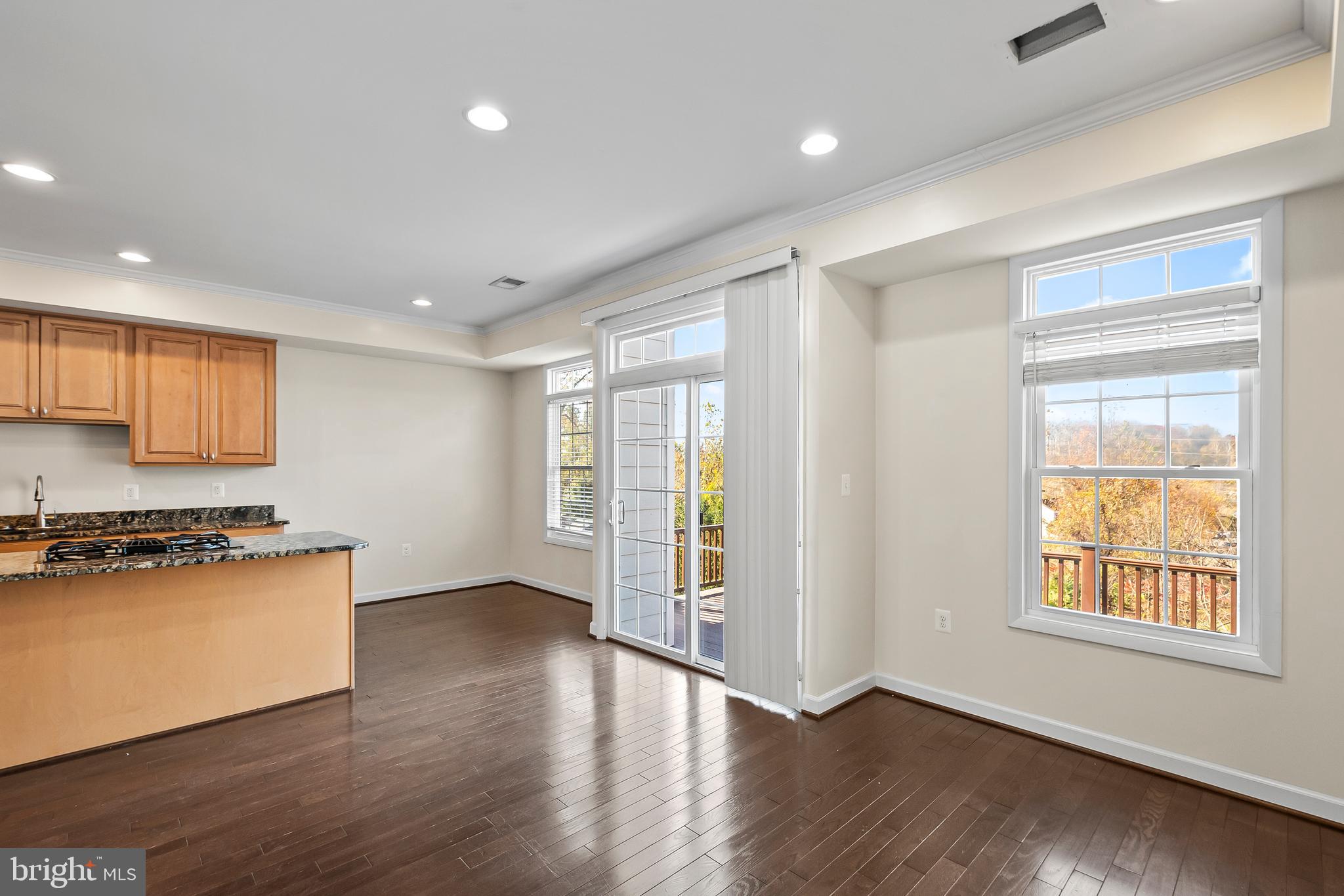 7872 Azalea Cove Terrace Alexandria, VA 22315 - Photo 13 of 30 a view of a kitchen with wooden floor and a window