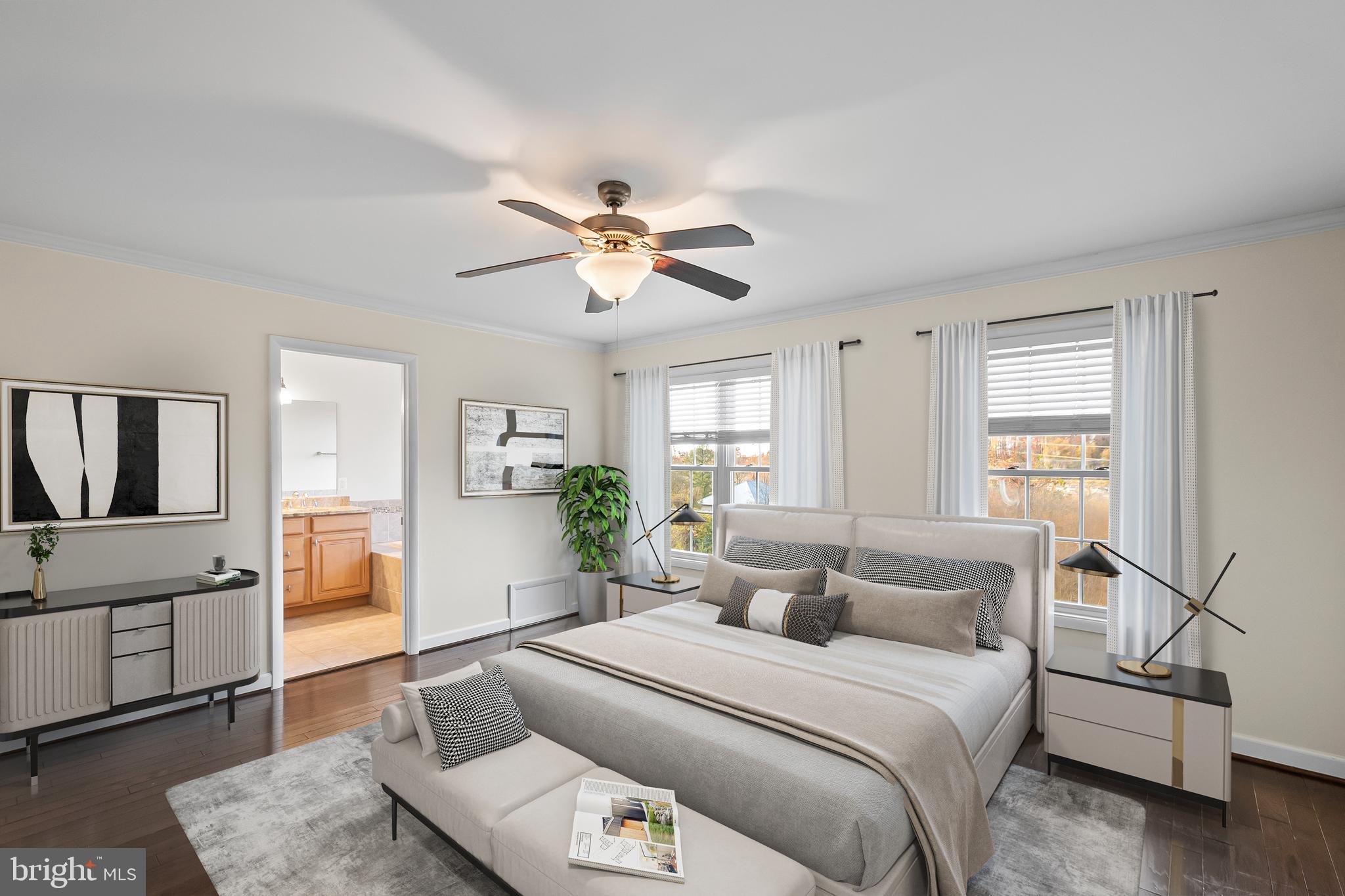7872 Azalea Cove Terrace Alexandria, VA 22315 - Photo 15 of 30 a spacious bedroom with a large bed a chandelier and windows
