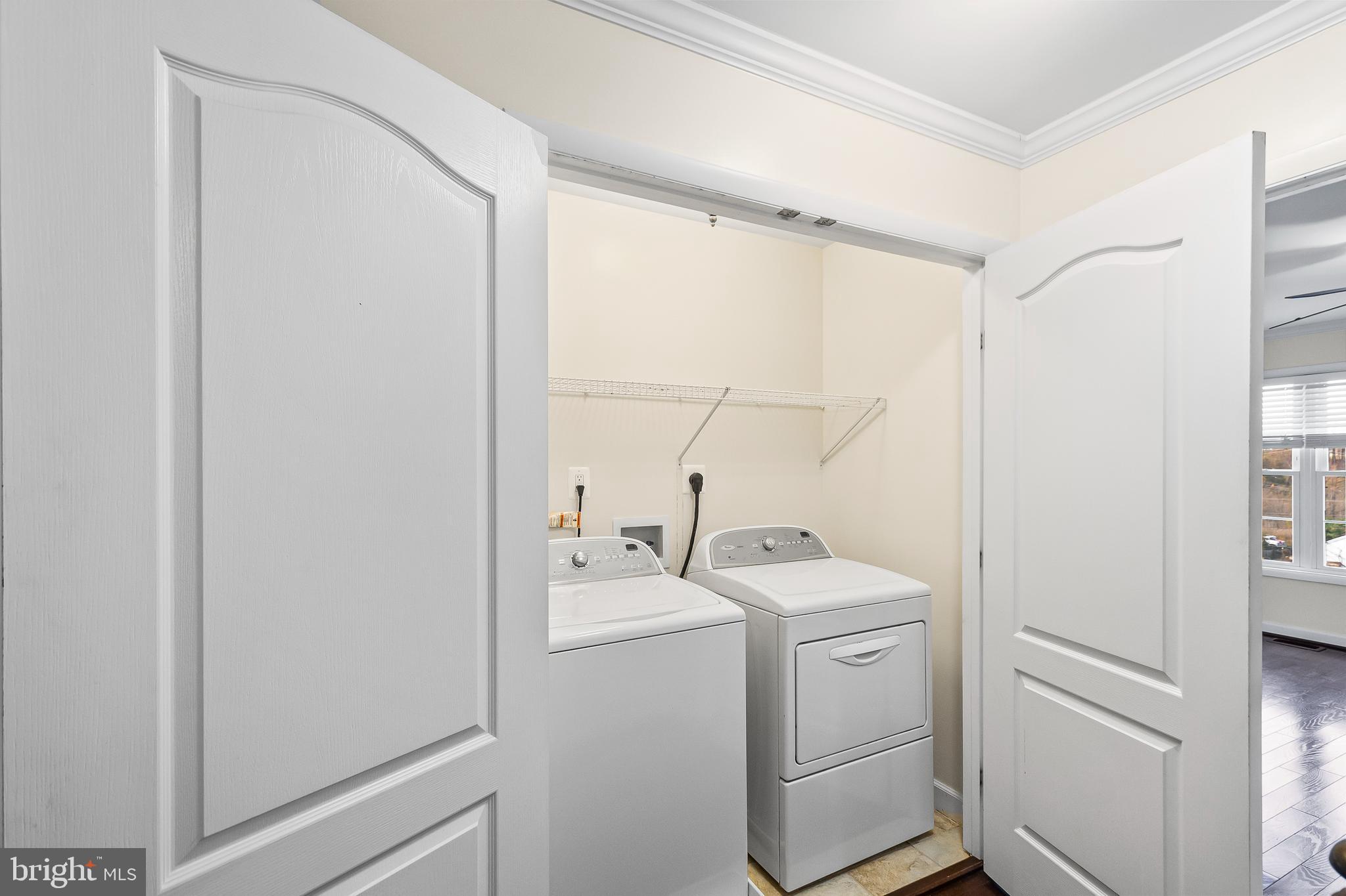 7872 Azalea Cove Terrace Alexandria, VA 22315 - Photo 21 of 30 a utility room with dryer and washer