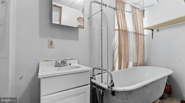 a bathroom with a sink and a bathtub