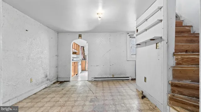 a view of a hallway with a bathroom