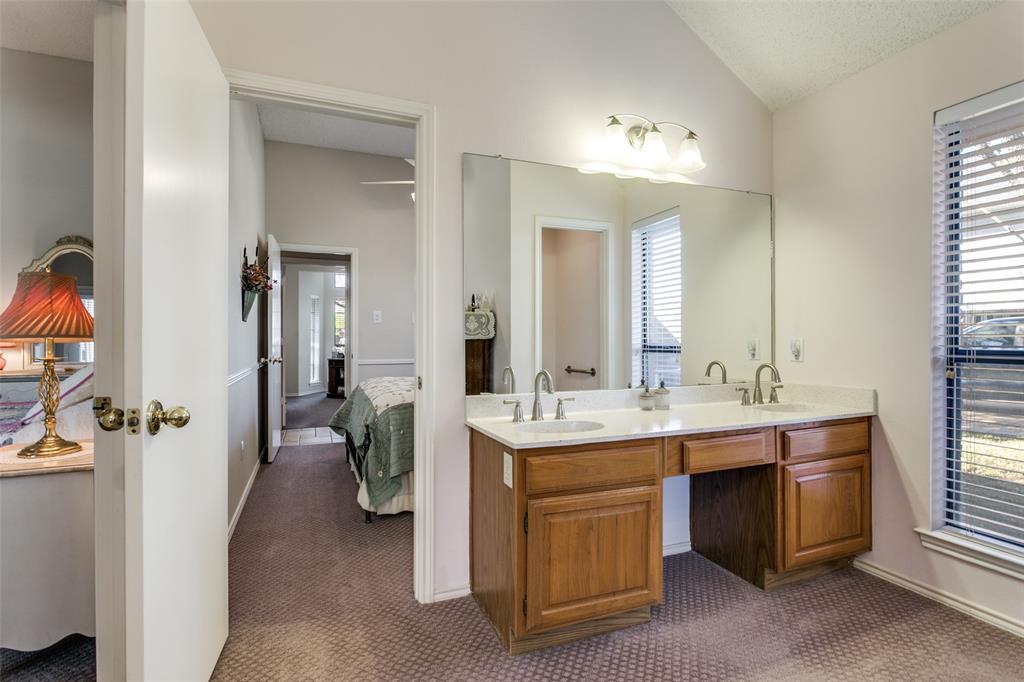 3414 Spring Willow Drive Grapevine, TX 76051 - Photo 16 of 25 a bathroom with a double vanity sink and a mirror