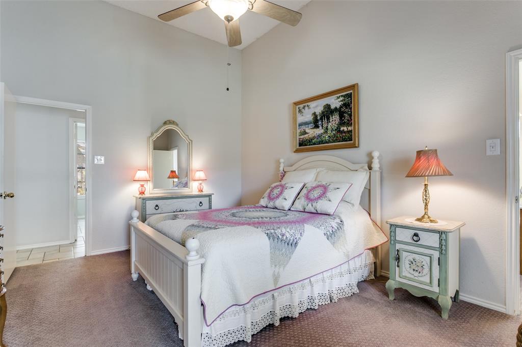 3414 Spring Willow Drive Grapevine, TX 76051 - Photo 20 of 25 a bedroom with bed and a chandelier