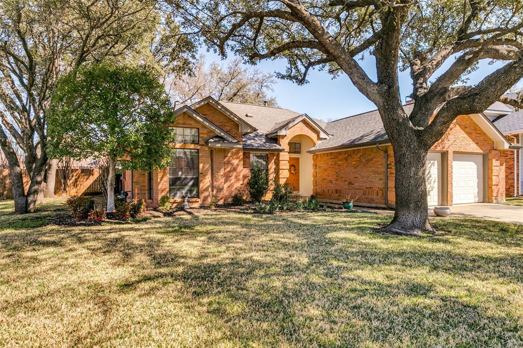 3414 Spring Willow Drive Grapevine, TX 76051 - Photo 2 of 25 a view of a house with large trees and wooden fence