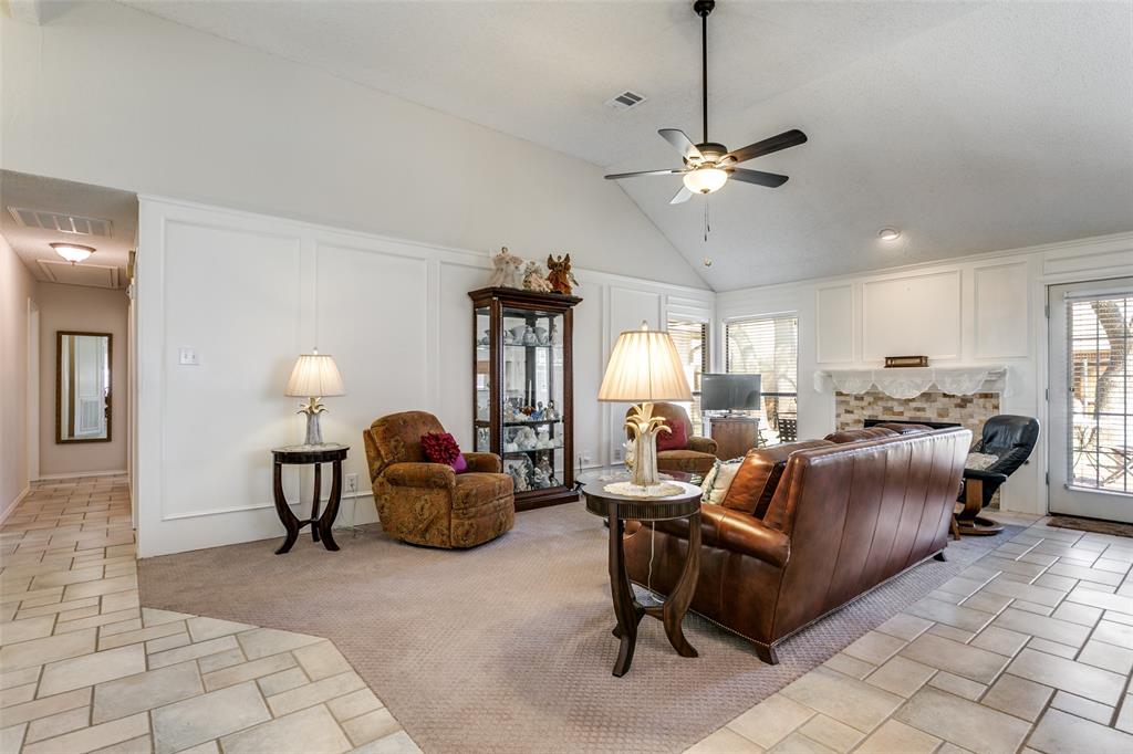 3414 Spring Willow Drive Grapevine, TX 76051 - Photo 6 of 25 a living room with furniture a dining table and a chandelier