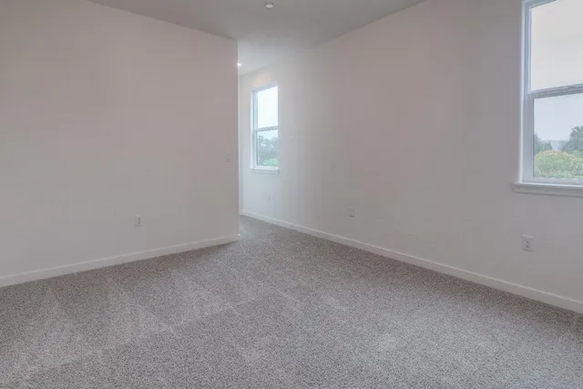 an empty room with windows