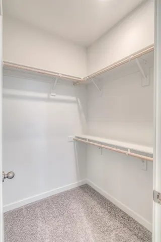a view of an empty walk in closet