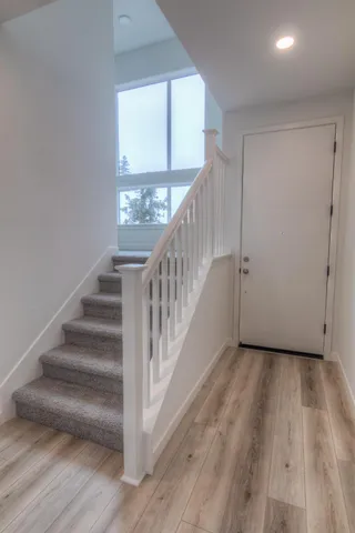 a view of entryway with wooden floor