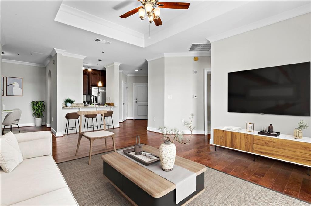a living room with furniture and a flat screen tv