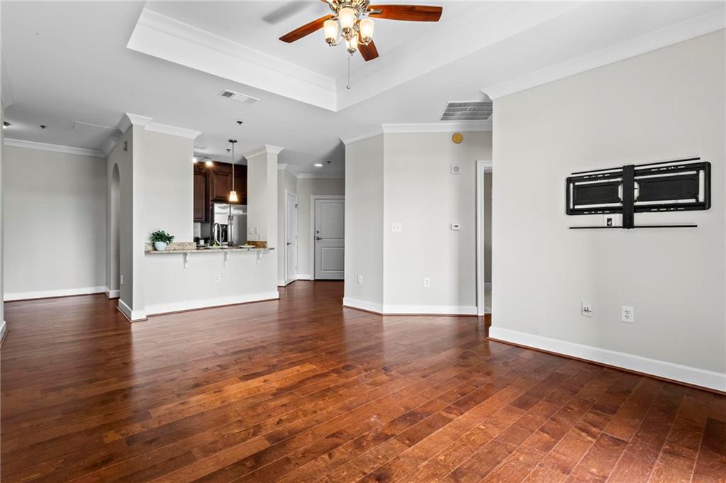 325 East Paces Ferry Road Northeast, Unit 703 Atlanta, GA 30305 - Photo 13 of 31 wooden floor in an empty room with a window