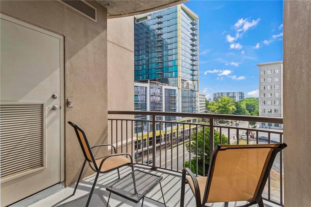 325 East Paces Ferry Road Northeast, Unit 703 Atlanta, GA 30305 - Photo 23 of 31 a view of a balcony with chairs