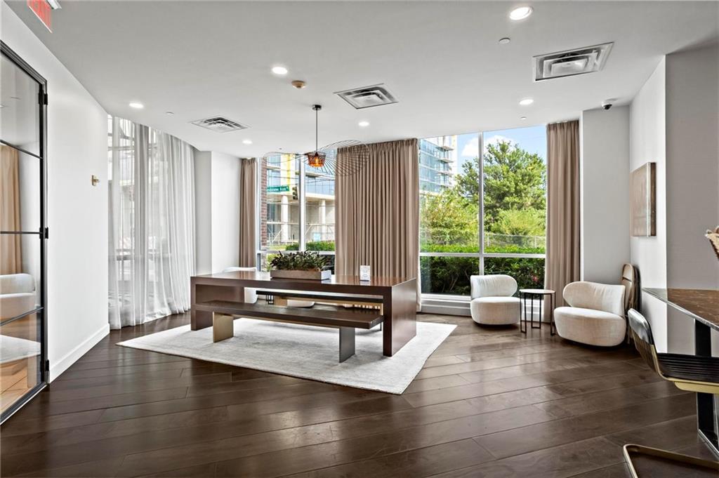 325 East Paces Ferry Road Northeast, Unit 703 Atlanta, GA 30305 - Photo 24 of 31 a living room with furniture and large windows