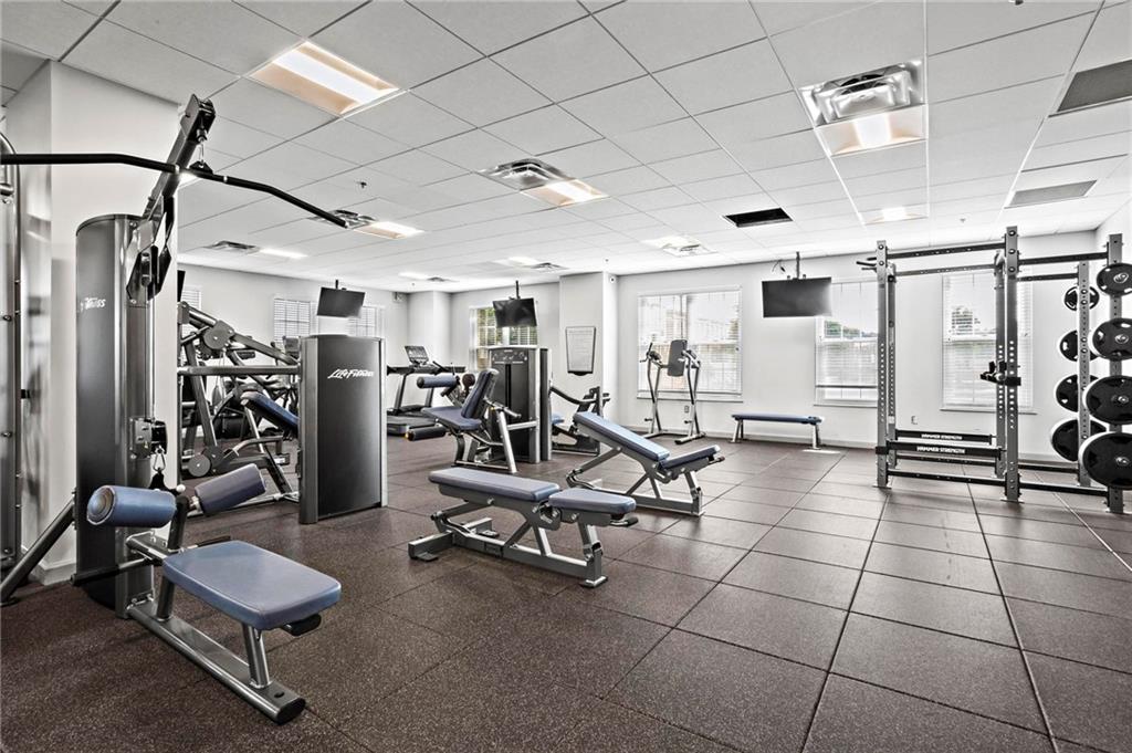 325 East Paces Ferry Road Northeast, Unit 703 Atlanta, GA 30305 - Photo 28 of 31 a view of a room with gym equipment