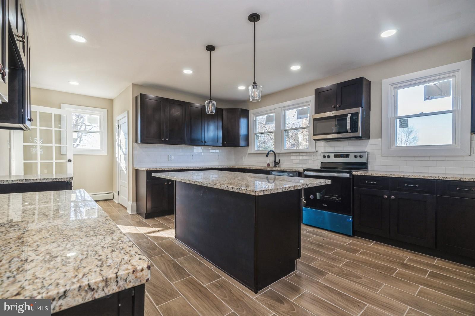 241 Glassboro Road Monroeville, NJ 08343 - Photo 4 of 24 a kitchen with stainless steel appliances granite countertop a sink stove and microwave