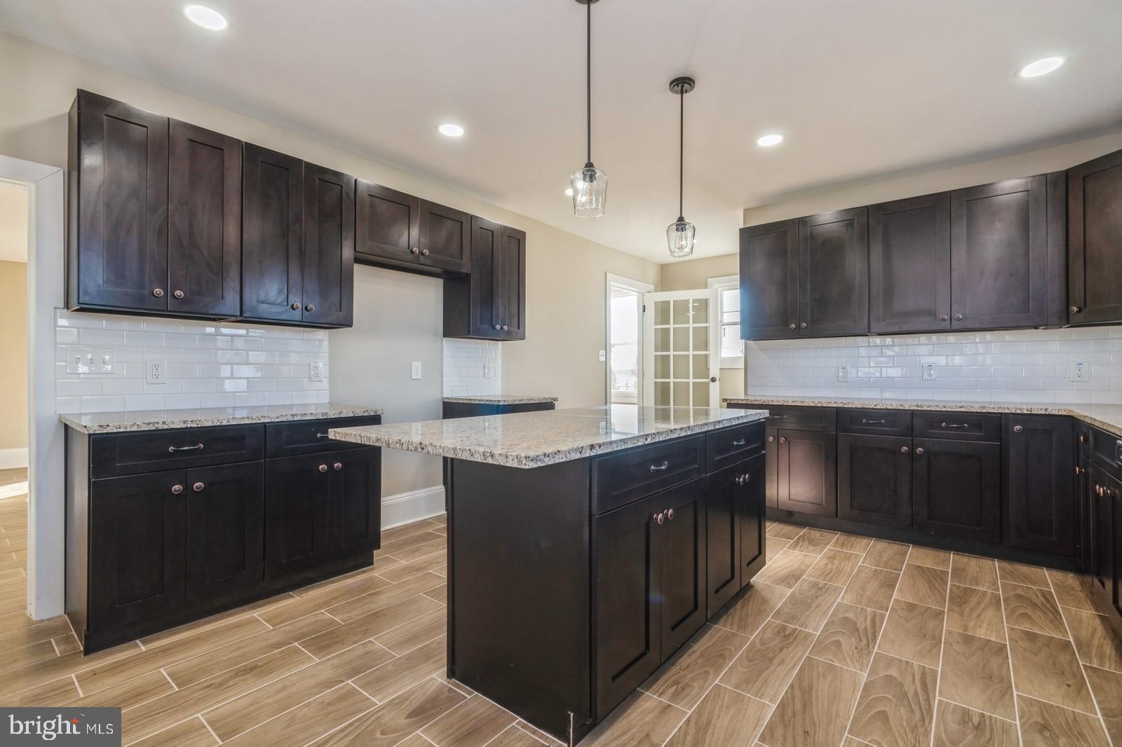 241 Glassboro Road Monroeville, NJ 08343 - Photo 5 of 24 a kitchen with stainless steel appliances granite countertop wooden cabinets a stove top oven a sink and dishwasher