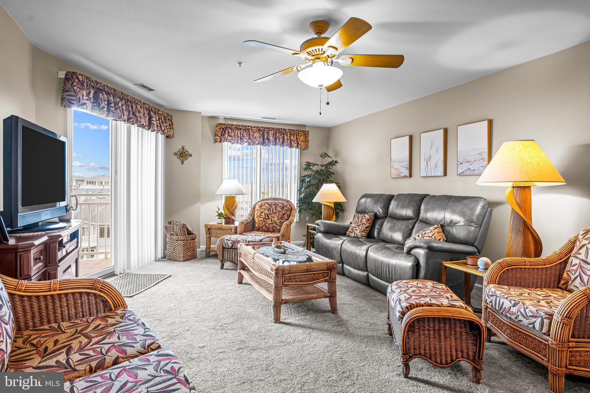 301 East Rochester Avenue, Unit 409 Wildwood, NJ 08260 - Photo 12 of 31 a living room with furniture a couch and a flat screen tv