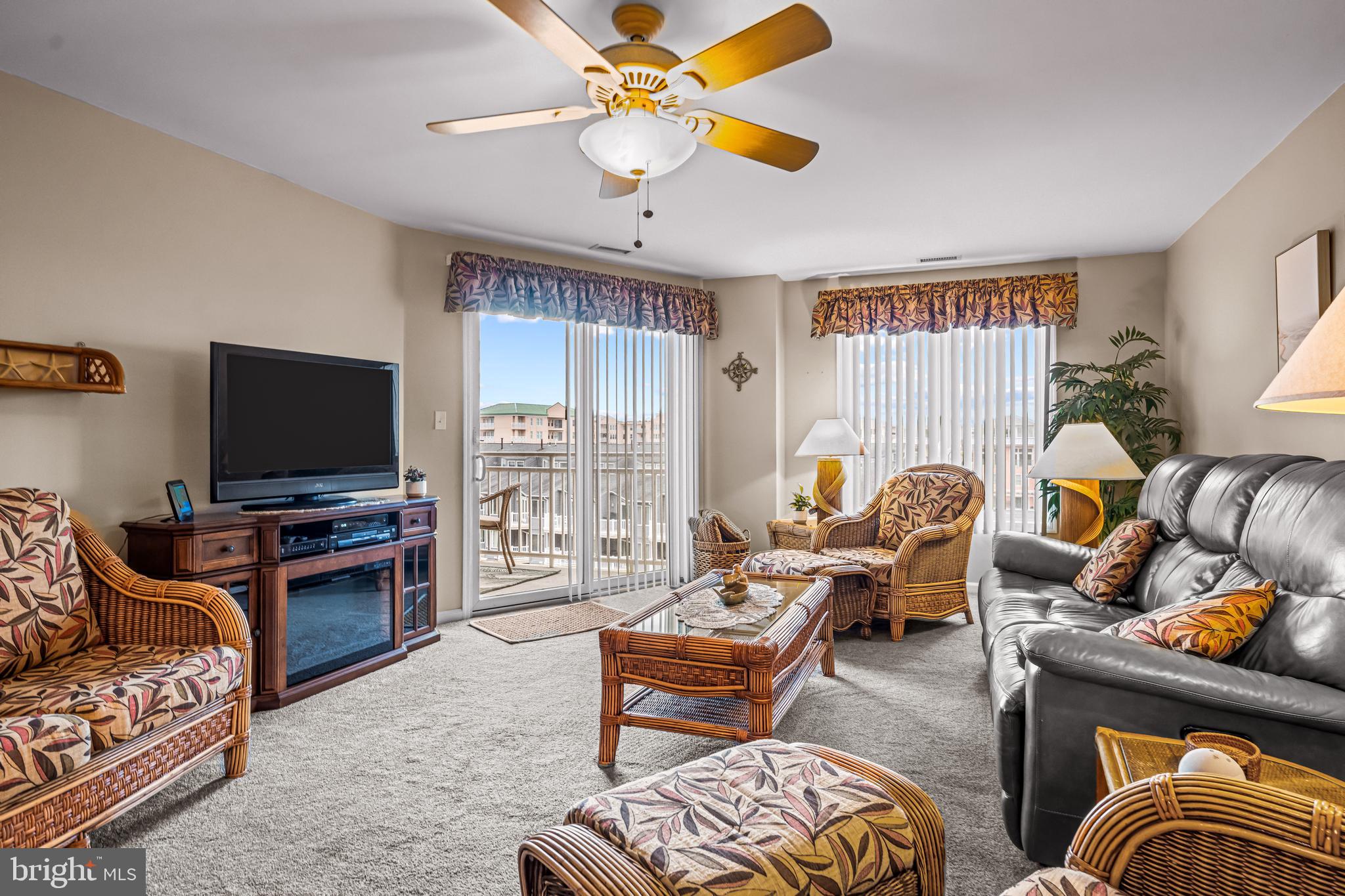 301 East Rochester Avenue, Unit 409 Wildwood, NJ 08260 - Photo 13 of 31 a living room with furniture and a flat screen tv