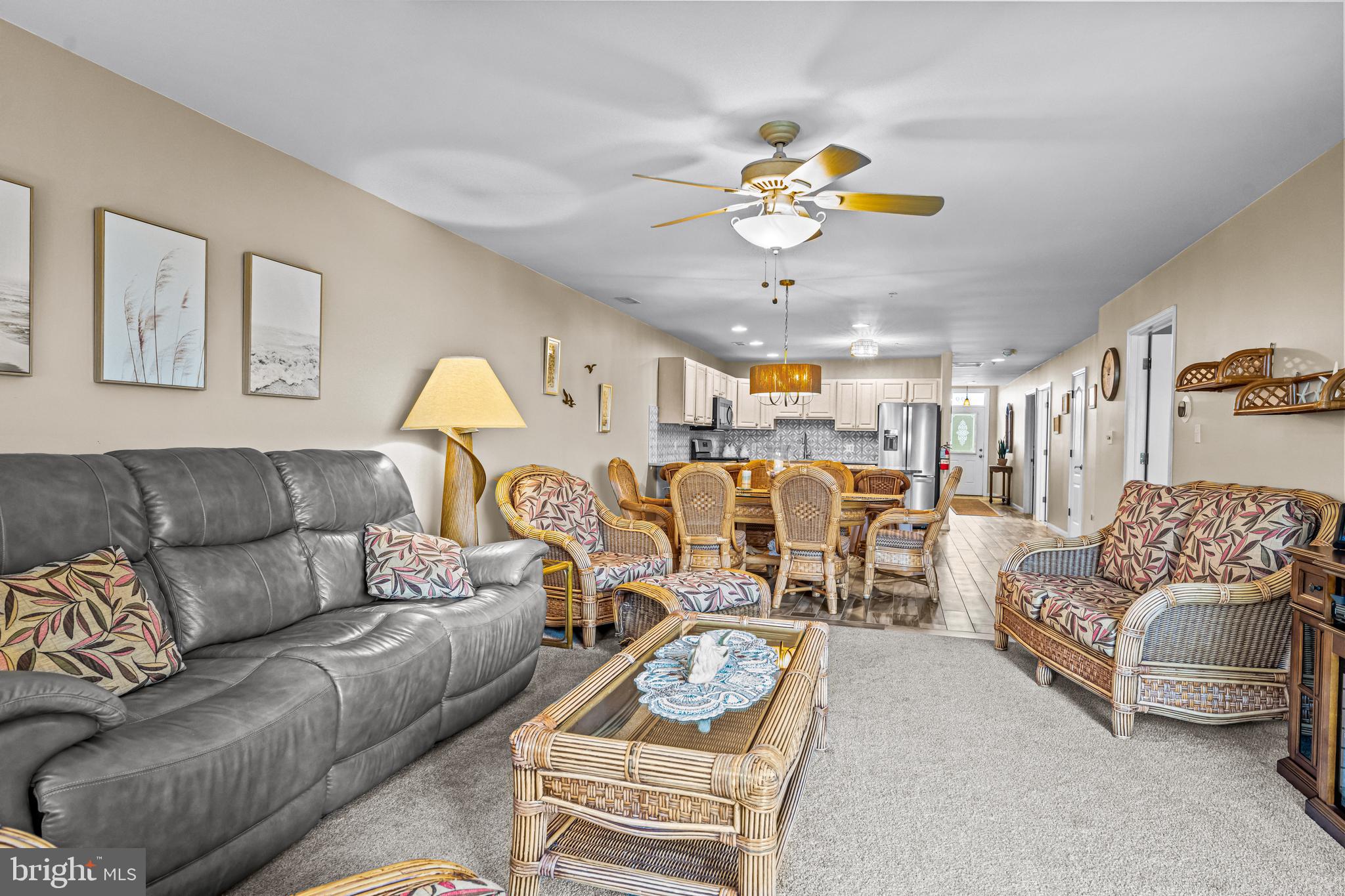301 East Rochester Avenue, Unit 409 Wildwood, NJ 08260 - Photo 15 of 31 a living room with furniture kitchen view and a chandelier