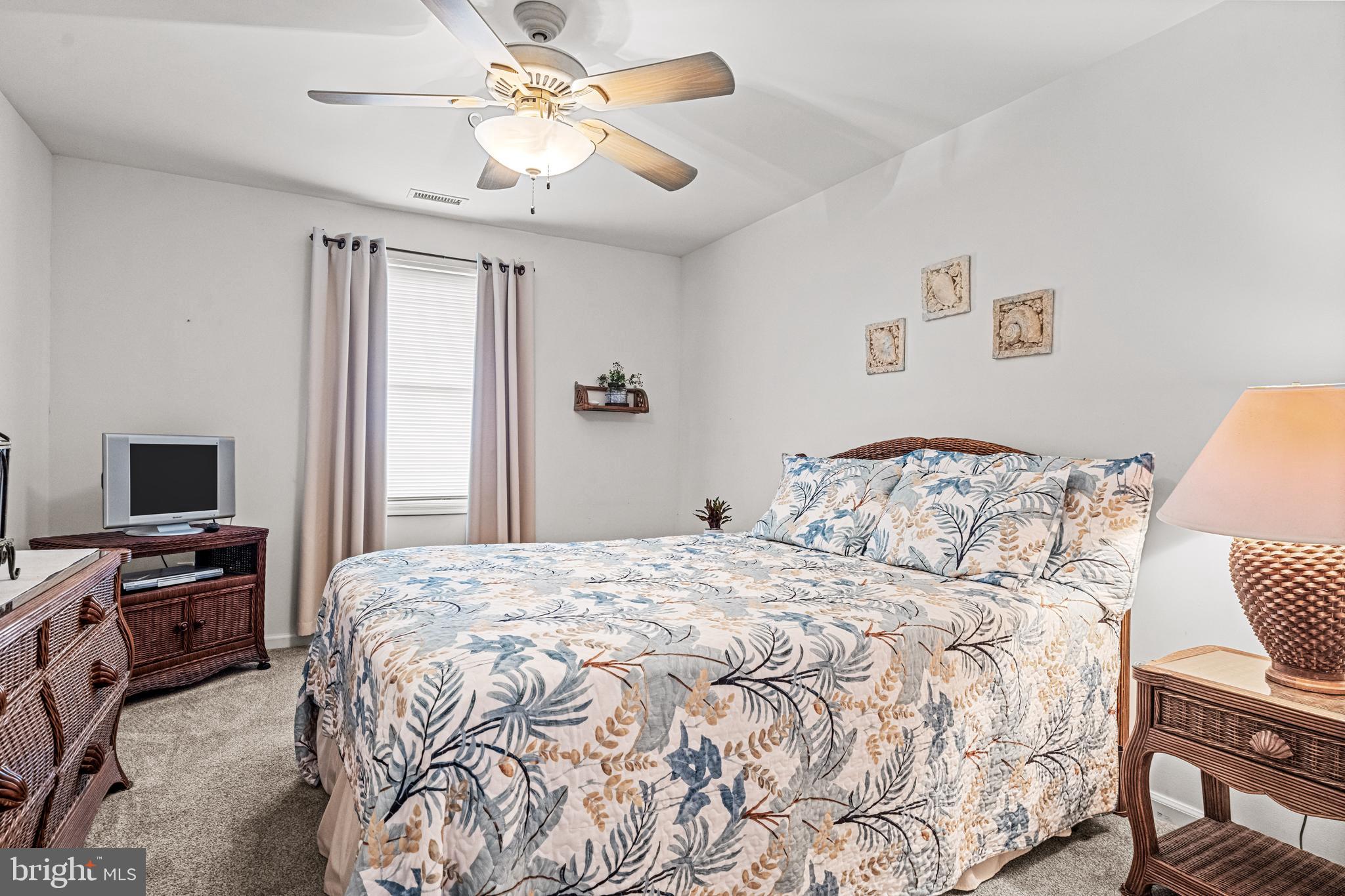 301 East Rochester Avenue, Unit 409 Wildwood, NJ 08260 - Photo 16 of 31 a bedroom with a bed and a tv