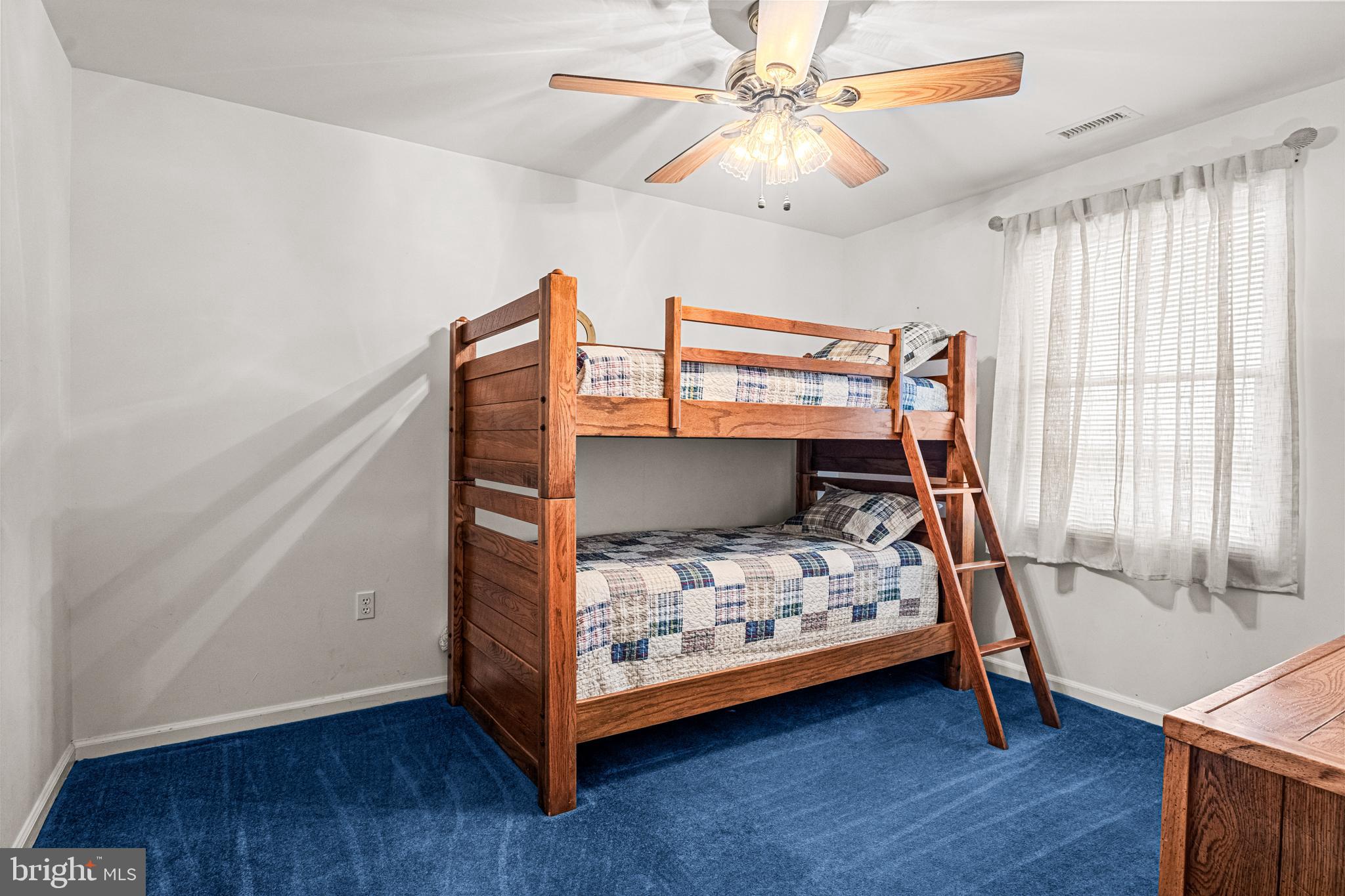 301 East Rochester Avenue, Unit 409 Wildwood, NJ 08260 - Photo 17 of 31 a bedroom with a bed and wooden floor