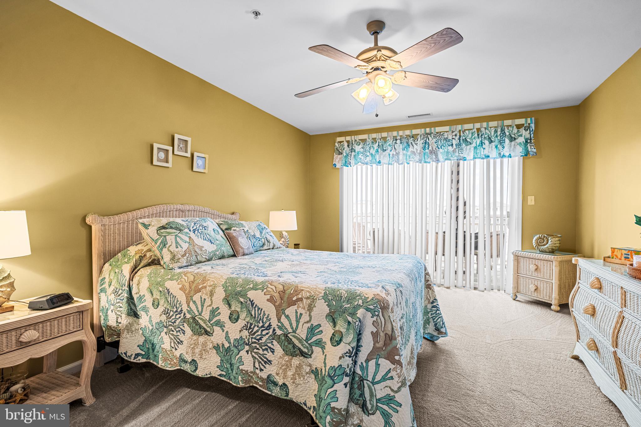 301 East Rochester Avenue, Unit 409 Wildwood, NJ 08260 - Photo 20 of 31 a bedroom with a bed and a chandelier
