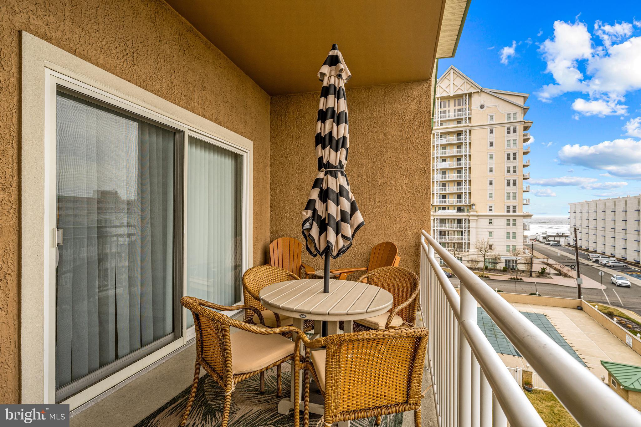 301 East Rochester Avenue, Unit 409 Wildwood, NJ 08260 - Photo 25 of 31 a view of a dining room with furniture and chandelier