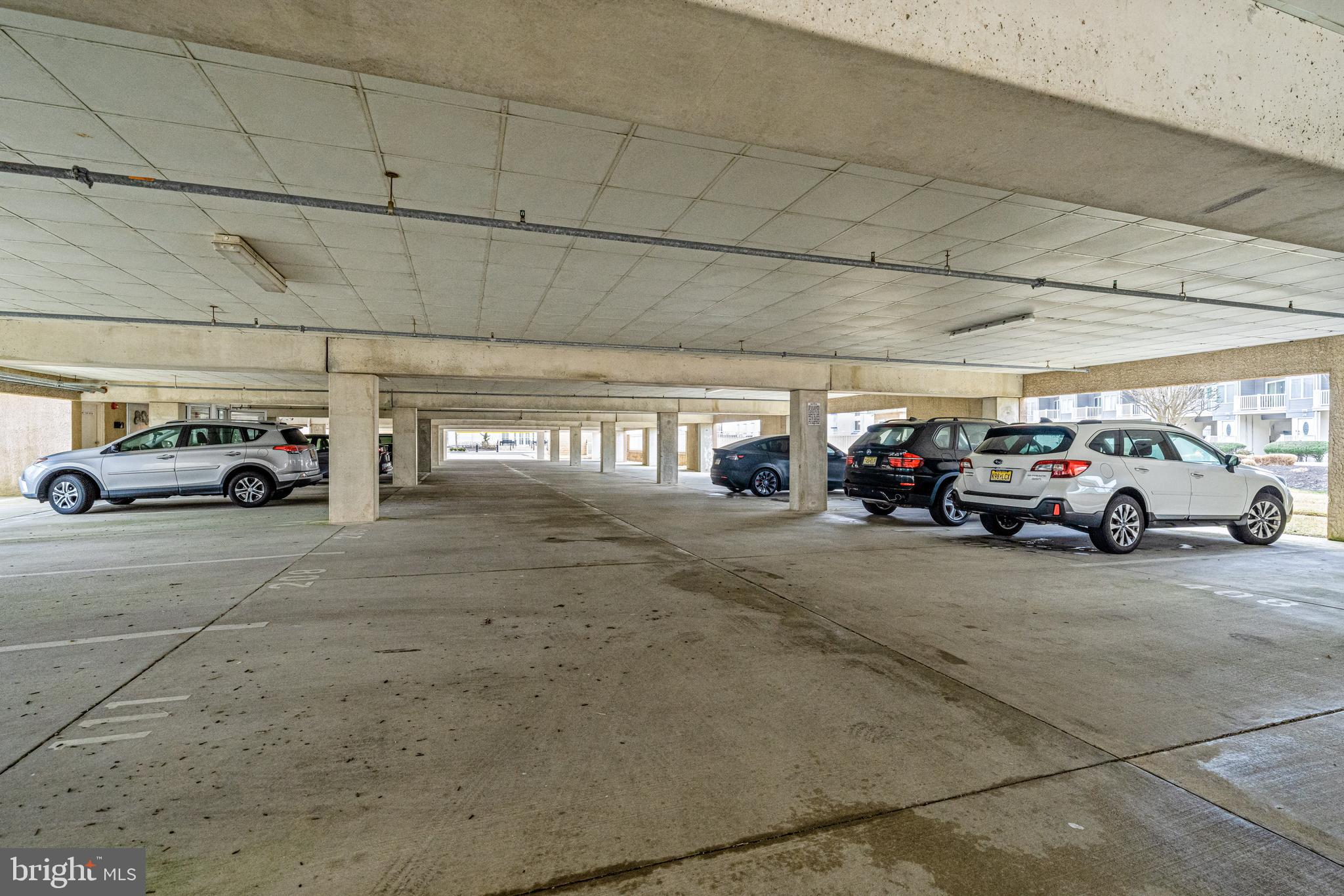 301 East Rochester Avenue, Unit 409 Wildwood, NJ 08260 - Photo 31 of 31 a view of parking space with parked cars