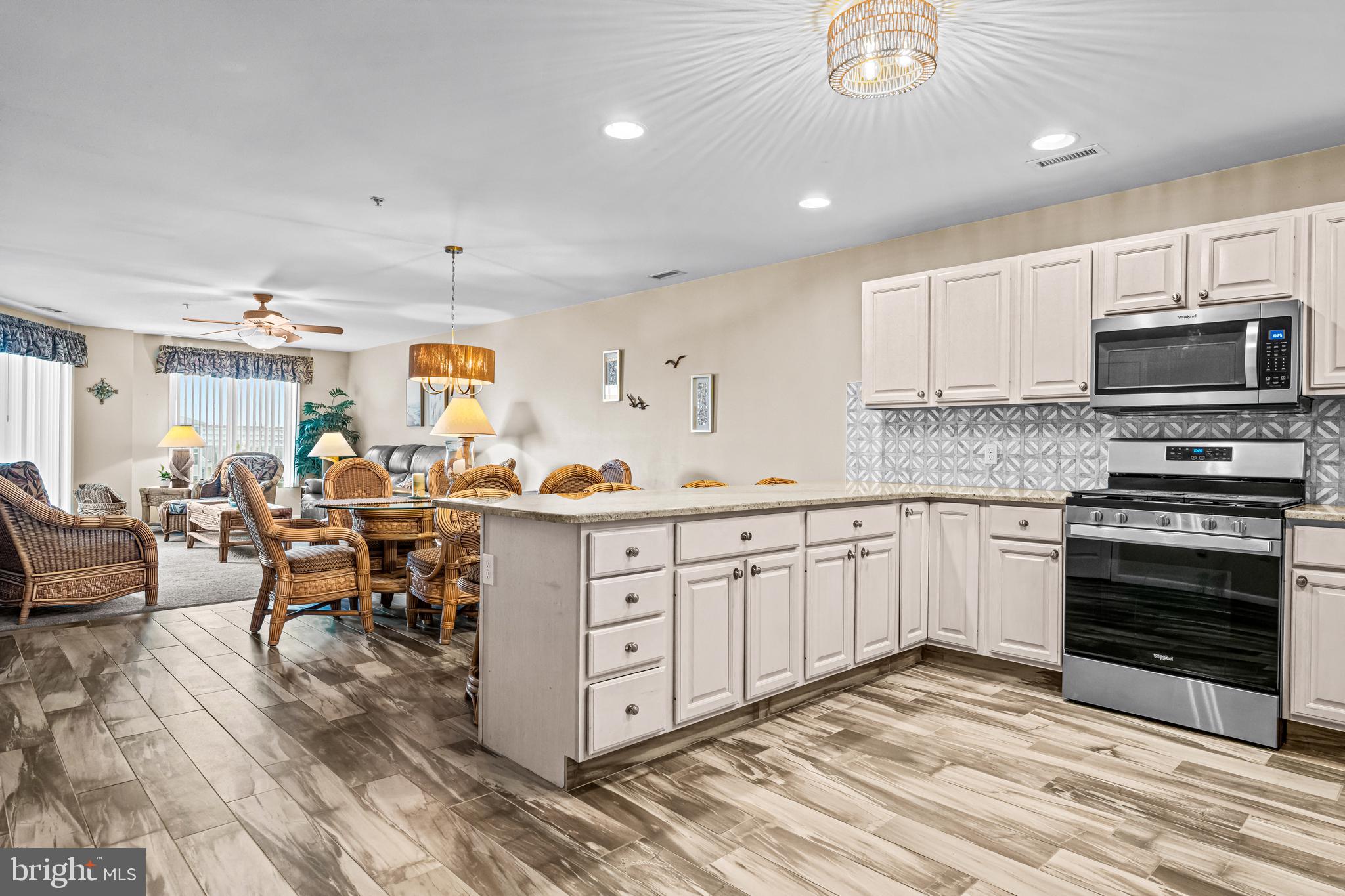 301 East Rochester Avenue, Unit 409 Wildwood, NJ 08260 - Photo 8 of 31 a kitchen with appliances a sink and counter space