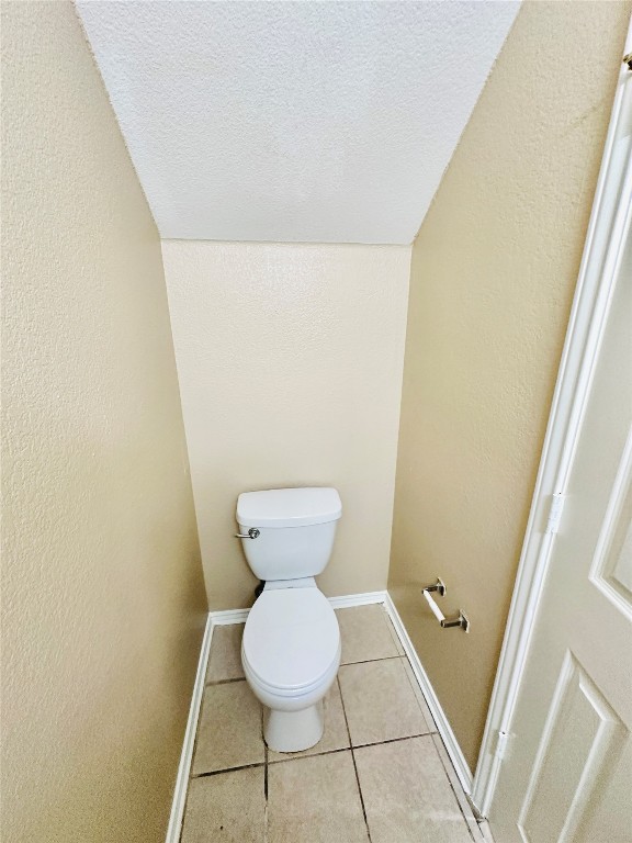 8814 Schick Road, Unit D Austin, TX 78729 - Photo 14 of 26 a bathroom with a toilet and a sink