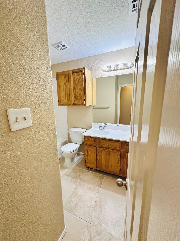 8814 Schick Road, Unit D Austin, TX 78729 - Photo 23 of 26 a bathroom with a tub sink mirror and toilet