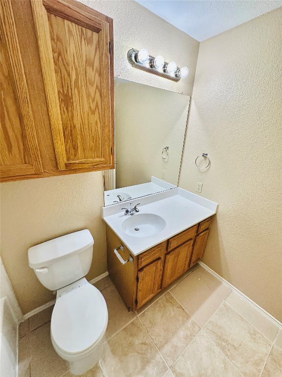8814 Schick Road, Unit D Austin, TX 78729 - Photo 24 of 26 a bathroom with a sink a toilet and a mirror