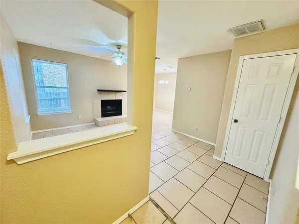 a view of a kitchen with a sink and a refrigerator