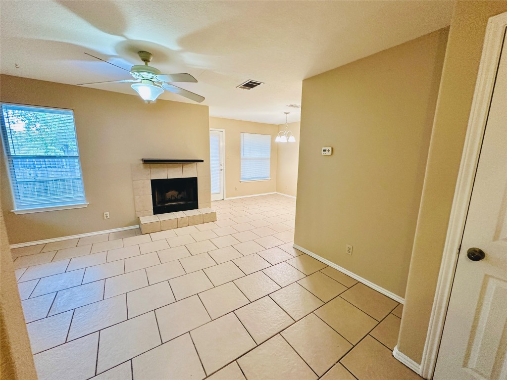8814 Schick Road, Unit D Austin, TX 78729 - Photo 5 of 26 a view of an empty room with wooden floor and a window