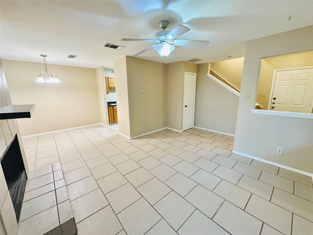 8814 Schick Road, Unit D Austin, TX 78729 - Photo 7 of 26 a view of an empty room and chandelier fan