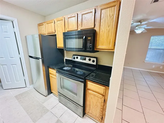 a view of a kitchen with a sink