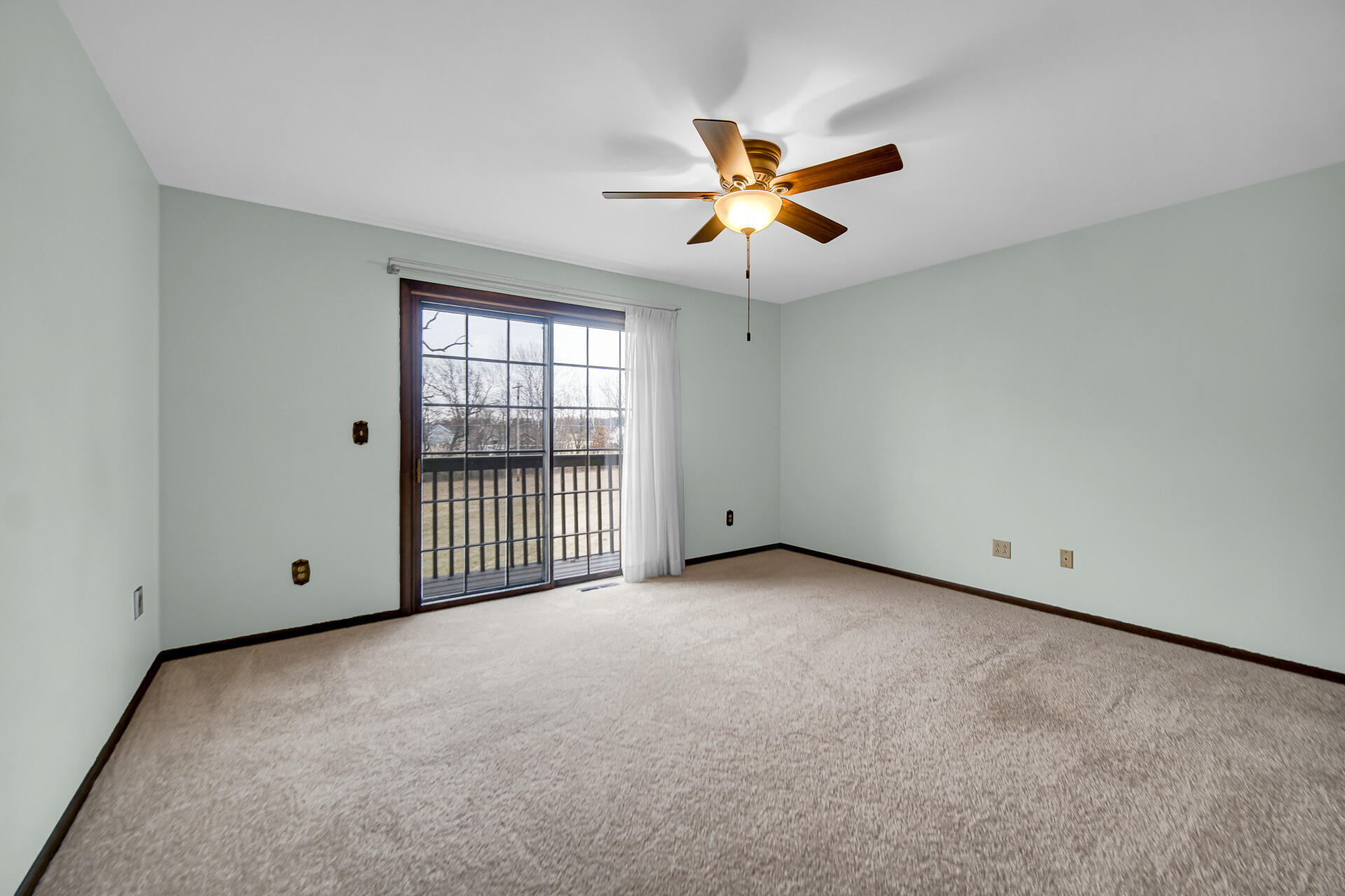 6955 Briergate Court Demotte, IN 46310 - Photo 22 of 44 a view of a livingroom with a ceiling fan and window